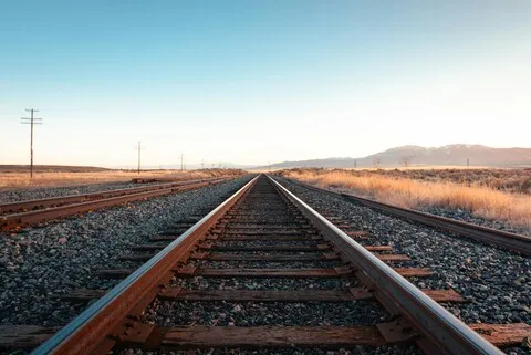 Railway tracks receding to the horizon, illustrating the sequential nature of walk-forward validation stepping through time.
