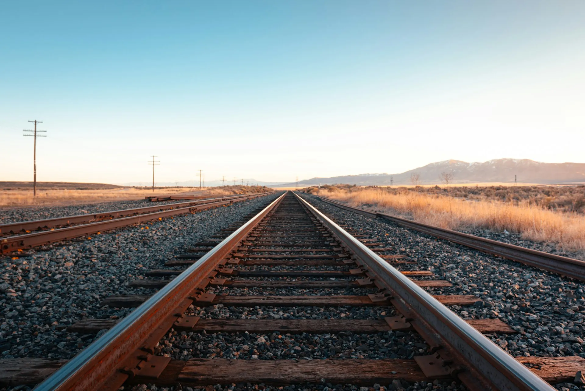 Railway tracks receding to the horizon, illustrating the sequential nature of walk-forward validation stepping through time.